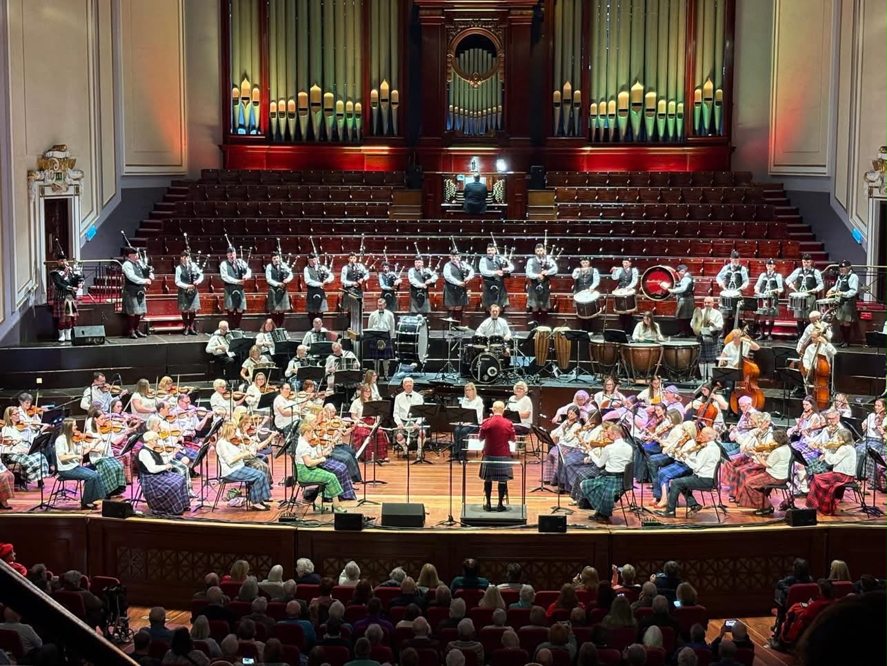 Stockbridge Pipe Band performing at the Usher Hall with full orchestra